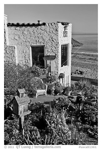 Garden, cottage, and beach. Capitola, California, USA (black and white)