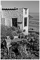 Garden, cottage, and beach. Capitola, California, USA (black and white)