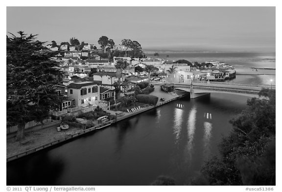 Bridges over Soquel Creek and village at dusk. Capitola, California, USA