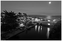 Capitola village, Soquel Creek and moon. Capitola, California, USA (black and white)