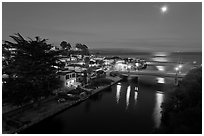 Capitola village, Soquel Creek and moon. Capitola, California, USA (black and white)