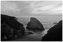 Offshore rock at sunset, Davenport. California, USA (black and white)
