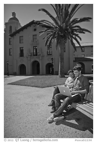 Students with laptop on bench. Stanford University, California, USA (black and white)