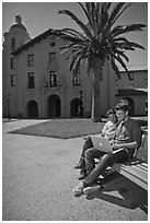 Students with laptop on bench. Stanford University, California, USA (black and white)