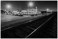 Railroad tracks and restaurant at night, Alviso. San Jose, California, USA (black and white)