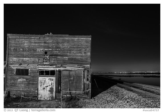 Shack, rails, and bay by night, Alviso. San Jose, California, USA