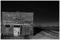 Shack, rails, and bay by night, Alviso. San Jose, California, USA ( black and white)