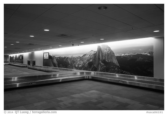 Baggage claim area with Yosemite murals, Fresno Yosemite Airport. California, USA (black and white)
