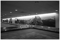 Baggage claim area with Yosemite murals, Fresno Yosemite Airport. California, USA ( black and white)