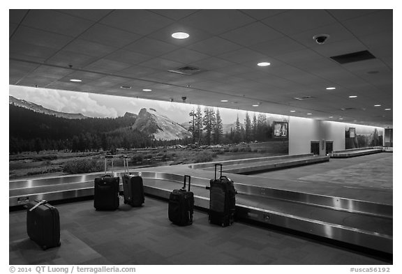 Baggage claim area and Yosemite murals, Fresno Yosemite Airport. California, USA (black and white)