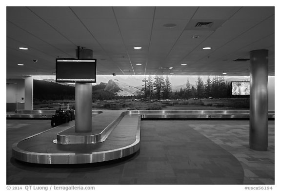 Baggage claim area and Tuolumne Meadows mural, Fresno Yosemite Airport. California, USA (black and white)