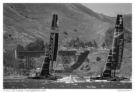 Emirates Team New Zealand leeward of Oracle Team USA at first mark. San Francisco, California, USA