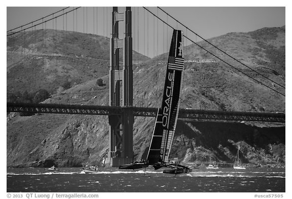 Oracle Team USA defender America's cup boat and Golden Gate Bridge. San Francisco, California, USA (black and white)