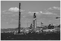 USA and New Zealand boats sailing upwind in front of Alcatraz Island. San Francisco, California, USA (black and white)