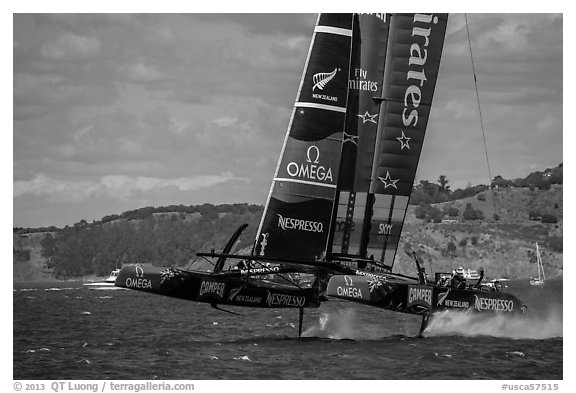 Emirates Team New Zealand Aotearoa catamaran foiling in upwind leg. San Francisco, California, USA (black and white)