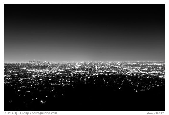 Lights of street grid and downtown at night from Griffith Park. Los Angeles, California, USA (black and white)
