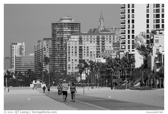 People exercising on beach promenade. Long Beach, Los Angeles, California, USA (black and white)