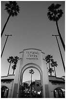 Entrance gate at dusk, Universal Studios. Universal City, Los Angeles, California, USA ( black and white)