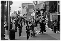 People stroll on Ocean Front Walk. Venice, Los Angeles, California, USA ( black and white)