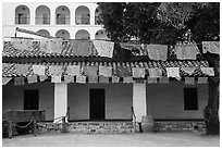 Colorful flags in courtyard. Santa Barbara, California, USA ( black and white)