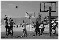 Men playing basketball, Mission Beach. San Diego, California, USA ( black and white)