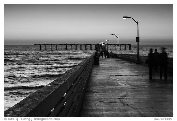 Walking on Ocean Beach Pier after sunset. San Diego, California, USA (black and white)