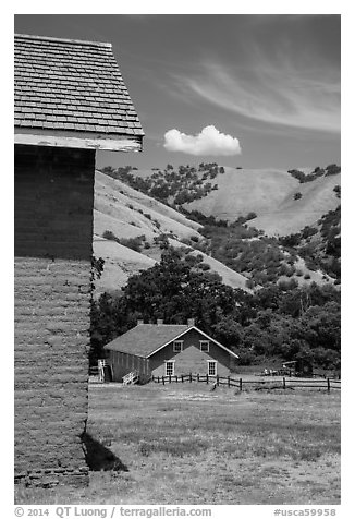 Barracks and hills, Fort Tejon state historic park. California, USA (black and white)