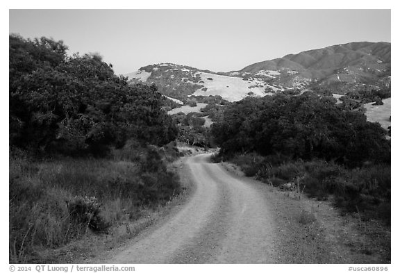 Road and hills at dusk. California, USA (black and white)