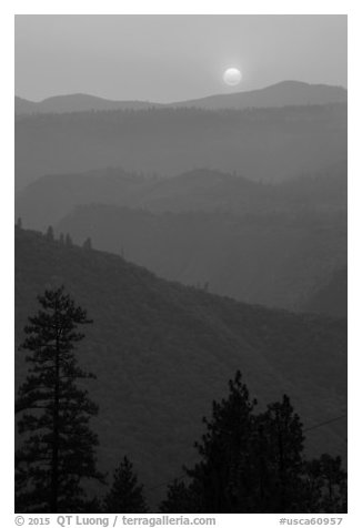 Sun setting over ridges, Stanislaus National Forest. California, USA (black and white)