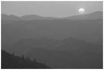Setting sun and mountain ridges, Stanislaus National Forest. California, USA ( black and white)