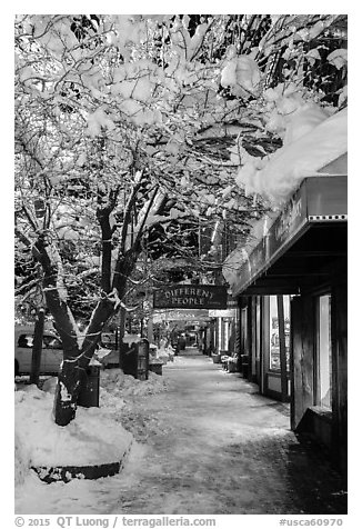 Sidewalk with fresh snow at night, Truckee. California, USA (black and white)