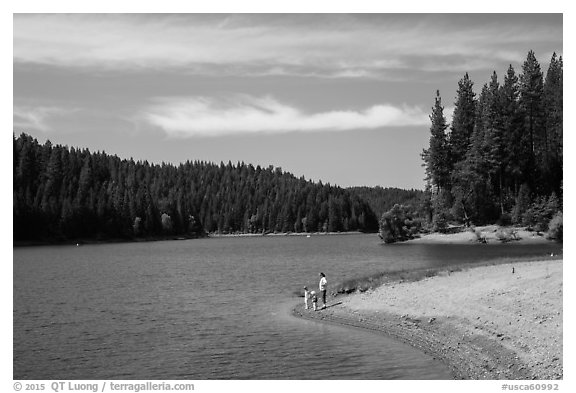 Family on shore of Jenkinson Lake, Pollock Pines. California, USA (black and white)