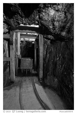 Tracks and car for ore removal, Gold Bug Mine, Placerville. California, USA (black and white)