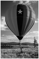 Hot air balloon low next to Prosser Reservoir, Tahoe National Forest. California, USA ( black and white)