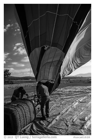 Crew pulling down hot air ballon, Tahoe National Forest. California, USA (black and white)