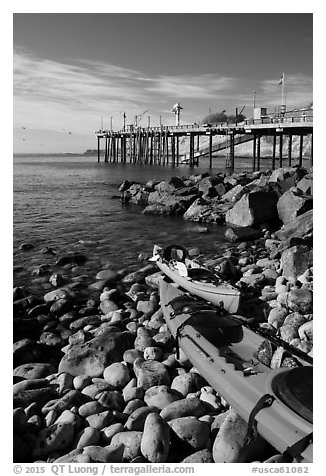 Sea Kayaks used for abalone diving and Wharf. California, USA (black and white)