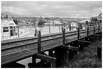 Railroad tresle and Petaluma River and Yacht Club. Petaluma, California, USA ( black and white)