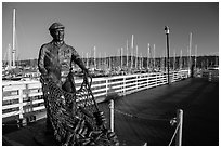 Statue of fisherman on wharf. Monterey, California, USA ( black and white)