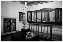 Room with cross and ceremonial dress, Mission San Juan. San Juan Bautista, California, USA ( black and white)