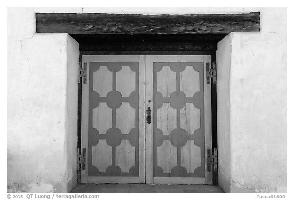 Decorated wooden door, Mission San Miguel. California, USA (black and white)