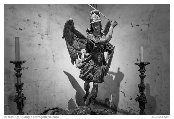 Statue of archangel San Miguel slaying dragon. California, USA (black and white)