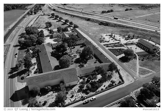 Aerial view of Mission San Miguel between railroad and highway. California, USA (black and white)