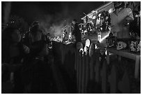 Children look at house with Halloween decorations. Petaluma, California, USA ( black and white)