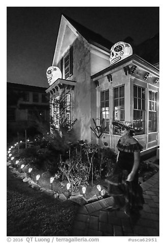 Woman in Halloween costume and decorated house. Petaluma, California, USA (black and white)