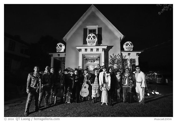 Halloween revelers and decorated house. Petaluma, California, USA (black and white)