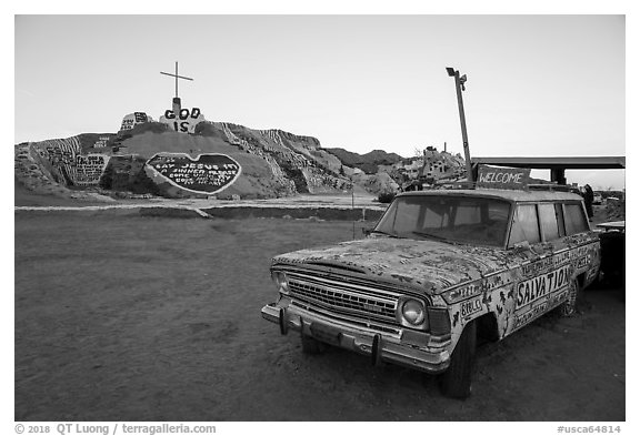 Painted car and Salvation Mountain. Nyland, California, USA (black and white)