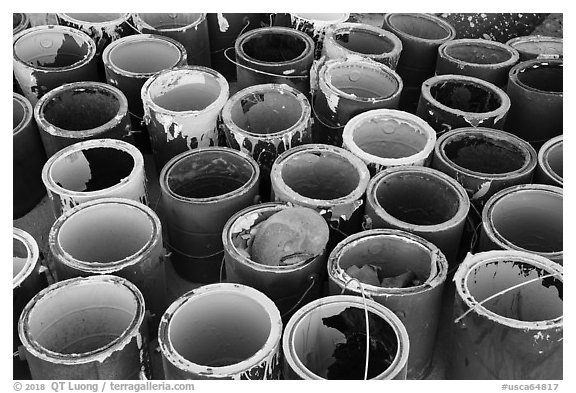 Pots of paint used on Salvation Mountain. Nyland, California, USA (black and white)