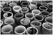 Pots of paint used on Salvation Mountain. Nyland, California, USA ( black and white)