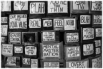 Wall of televisions covered with slogans, Slab City. Nyland, California, USA ( black and white)