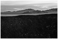 Amboy Crater rim and mountains. Mojave Trails National Monument, California, USA ( black and white)